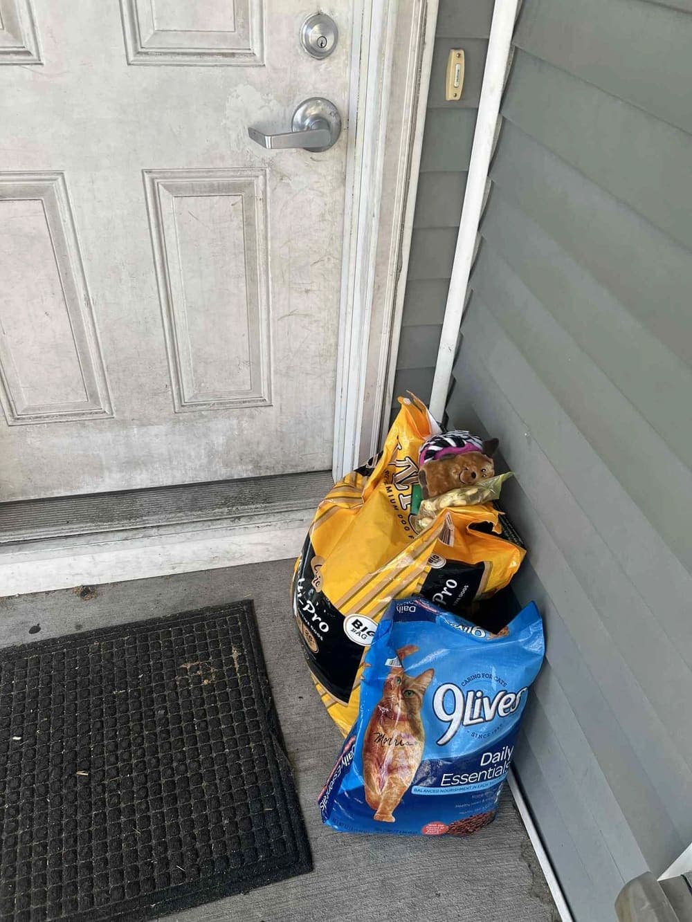 Donated dog and cat food left at a doorstep on a drop day